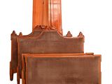 a bed with a wooden headboard and foot board on top of it