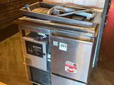 an image of a kitchen with a stove and a refrigerator