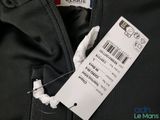 an image of a label on a black jacket with a tag attached to it