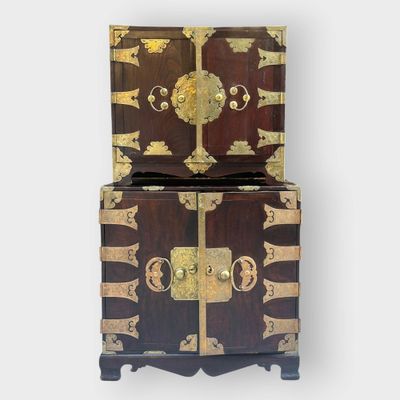 an image of a wooden chest with two doors on top of it