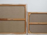 two pictures of a couple of frames hanging on the wall