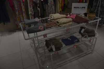a display of clothing on a rack in a clothing store