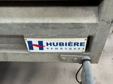 a trailer with a sign on the back of it