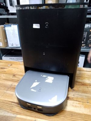 a computer sitting on top of a wooden table
