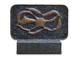 a bronze sculpture of a snake on a marble base