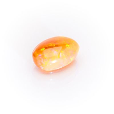a yellow oplite gems on a white background