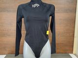 a mannequin with a black bodysuit on a table