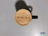 a close up of a small wooden object on a table