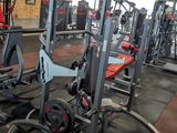 a gym with a lot of equipment in the room