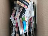 a cardboard box filled with magazines and magazines
