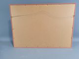an empty cardboard box with a piece of paper on top of it