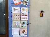 a picture of a door with a bunch of cards on it