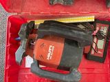 a red tool box with tools in it on the floor