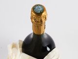 a bottle of wine in a paper bag on a table