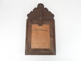 an old wooden picture frame hanging on a white wall