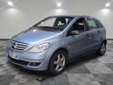 a picture of a blue mercedes b - class parked on a checkered floor