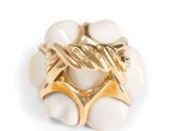 an image of a white and gold ring on a white surface