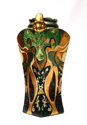 a vase with a painting on it sitting on a table