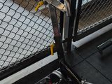 a bike leaning against a fence in front of a gate