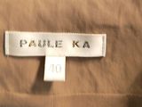 the label of a tan jacket with a white tag on it