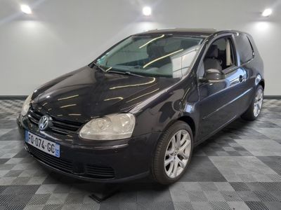 a picture of a black car parked in a garage