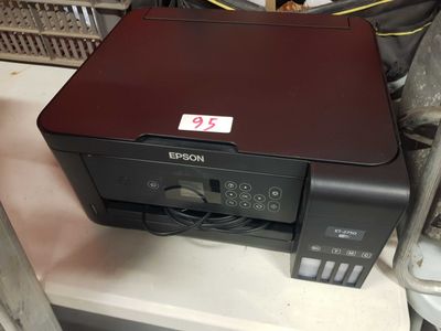 a printer that is sitting on top of a counter