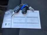 a picture of a bunch of car keys sitting on top of a piece of paper
