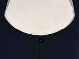 a close up of a mannequin torso wearing a black dress
