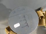 a picture of a piece of metal with a tag on it
