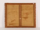 a close up of a wooden frame on a white surface