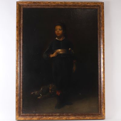 portrait of a young boy in a black suit with a book in his hand