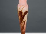 an image of a pink and brown vase sitting on top of a white table