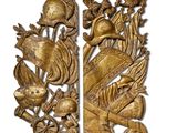 pair of antique carved wood panels with birds and flowers on them