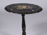 a black table with a floral design on it