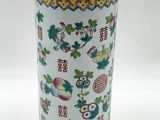 an image of a white vase with colorful designs on it