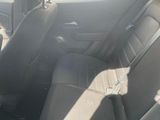 the back seats of a car are empty in the sun