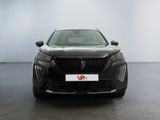 the front view of a black car in a white room
