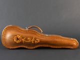 an image of a wooden guitar case sitting on top of a table