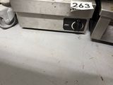 an image of a kitchen with a stove and a toaster oven