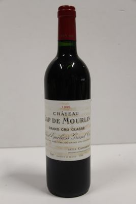 a bottle of wine that is sitting on a table