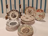 a lot of plates on the table with candlesticks