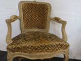 an old chair with a gold and brown upholstered upholstered upholstered upholstered up