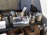 many pots and pans sitting on a table