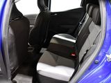 the back seats of a blue car with a black seat belt