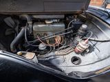 a black car with a engine in the back of it