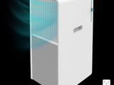 an image of a small white air conditioner with a remote control