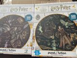 Des puzzles Harry Potter et Hermione dans une boîte posée sur une table