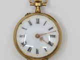 an image of a gold pocket watch with roman numerals on the face