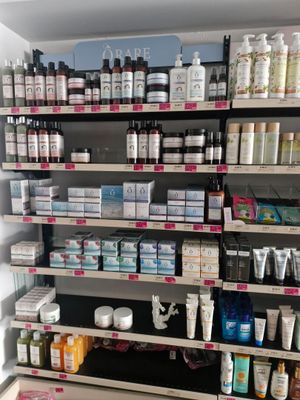 many different types of skin care products on the shelves
