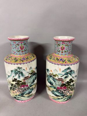 pair of chinese vases with landscape and flowers on them